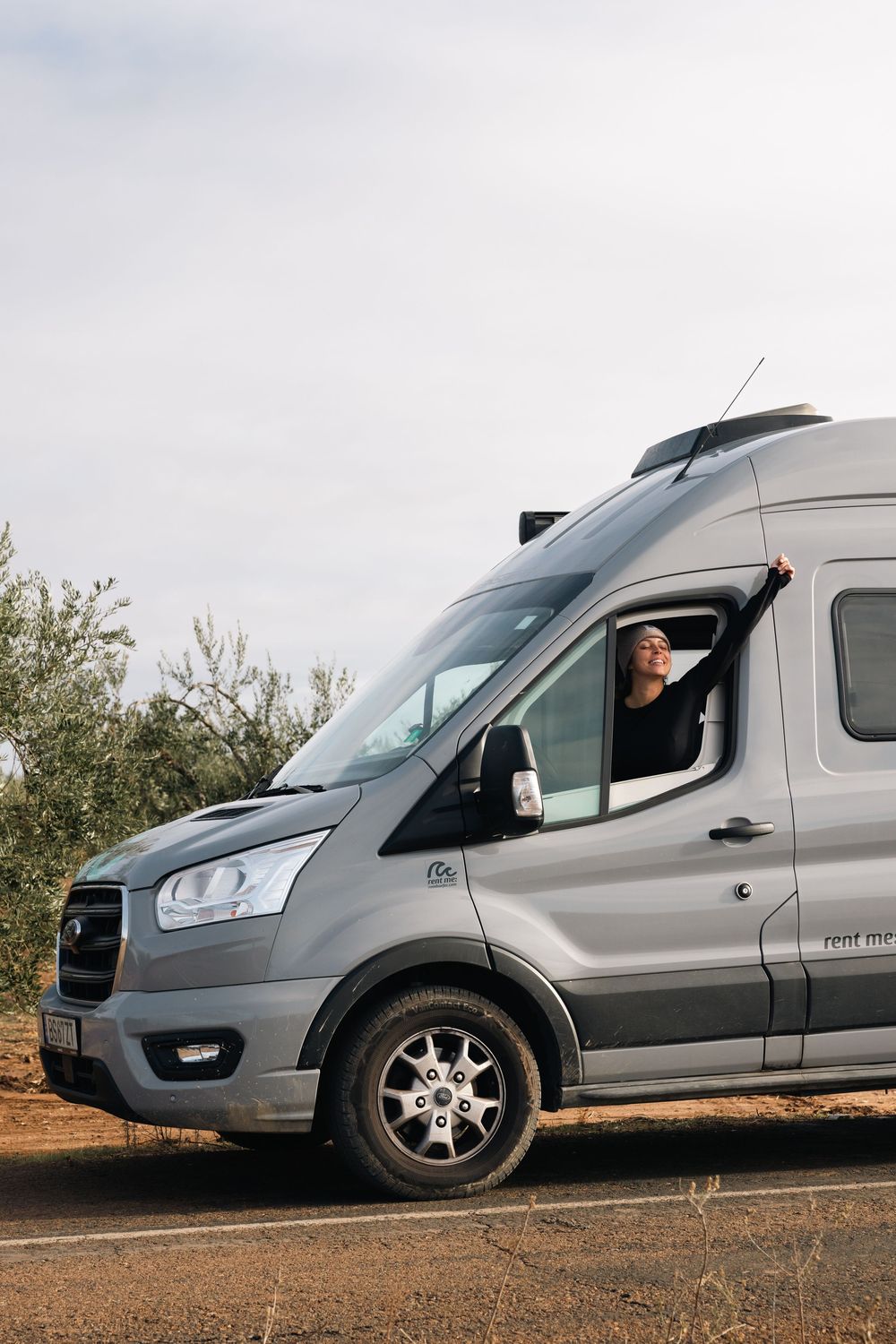 Silver Ford Transit van shown from different angles on a rural road.