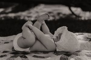 Dramatic black and white photography with soft shadows and textures.