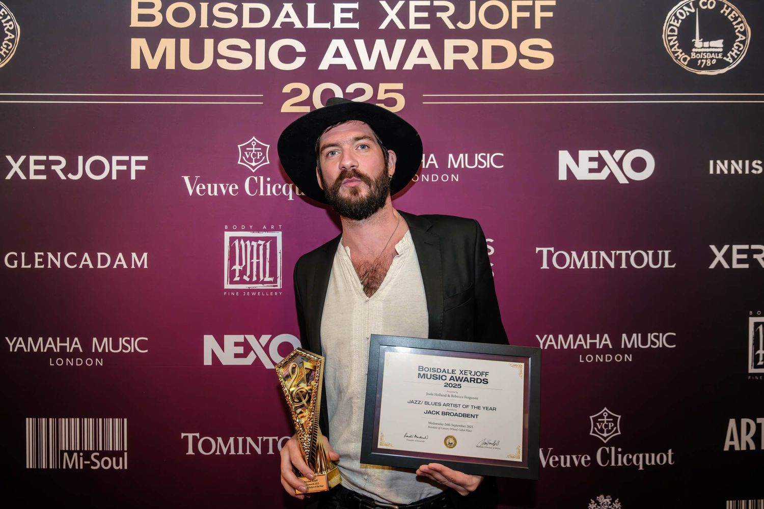Award ceremony stage setup with Boisdale Xerjoff Music Awards 2025 branding and sponsor logos displayed.
