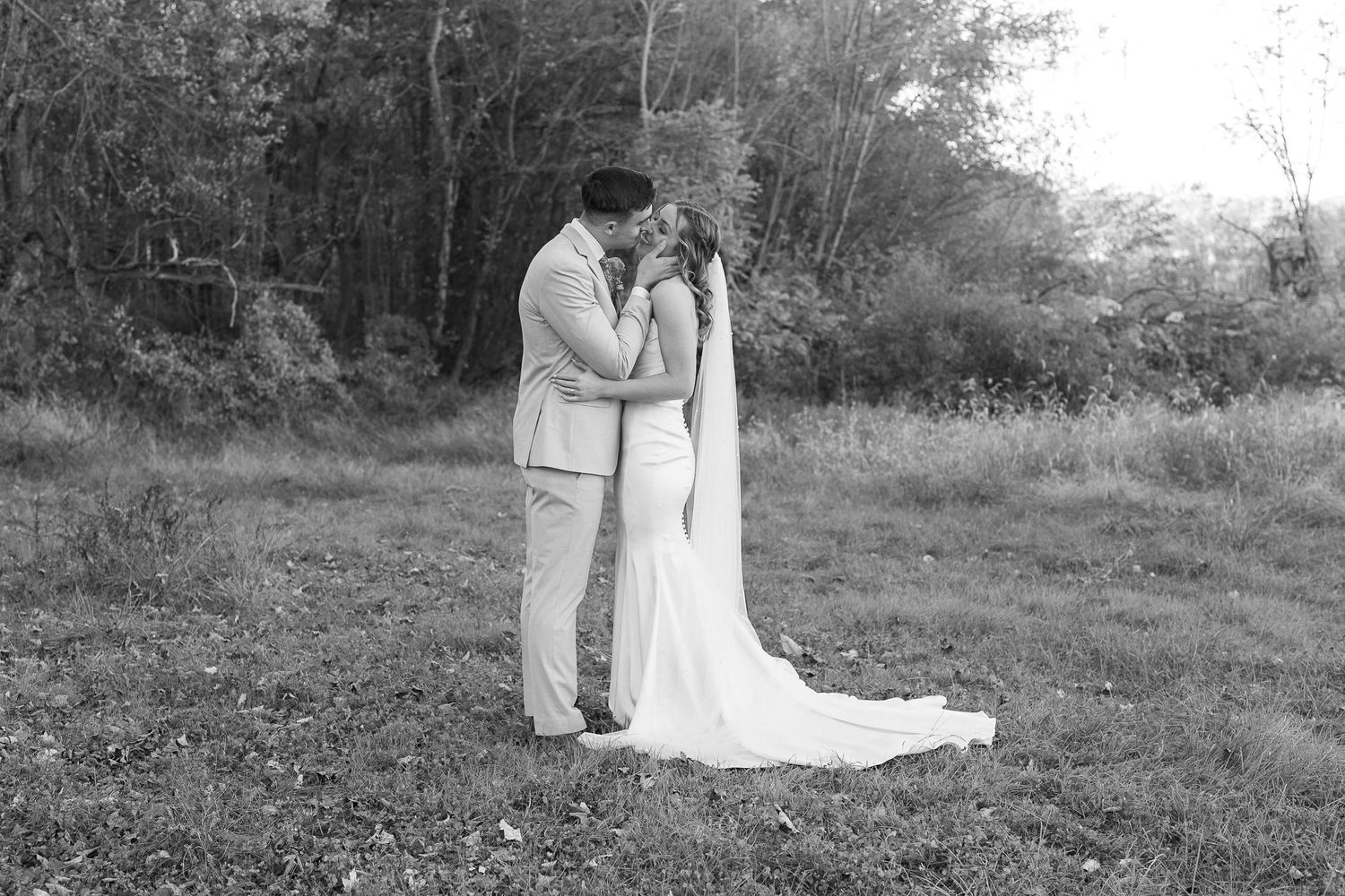 Black and white romantic outdoor photo sequence showing tender moments.