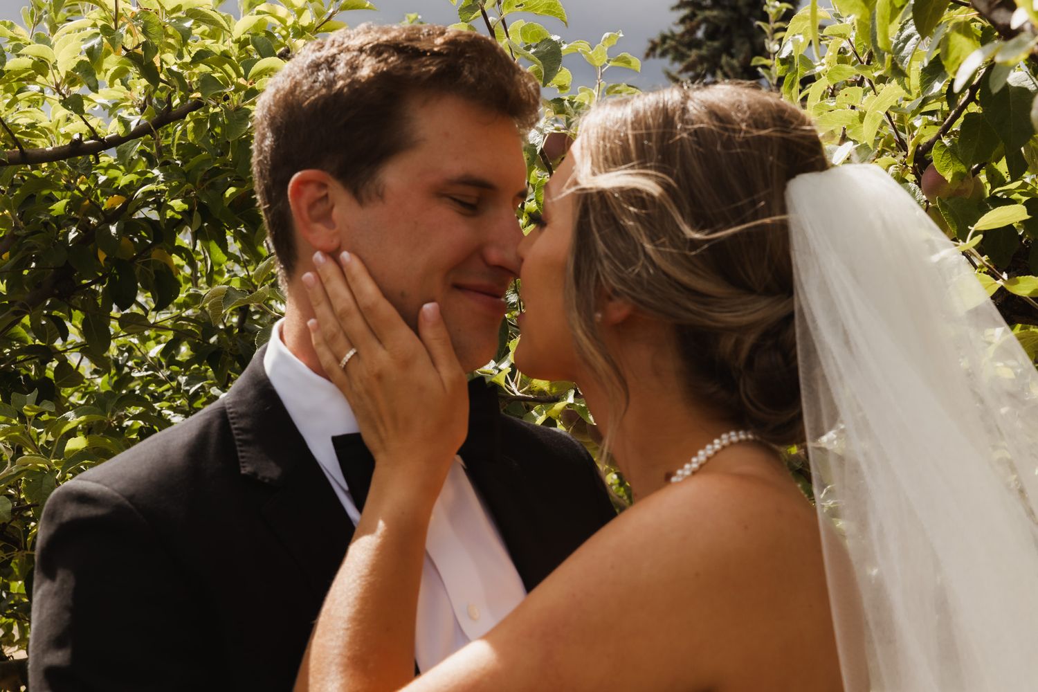 A romantic wedding moment captured in a garden setting. Spokane wedding photographer.