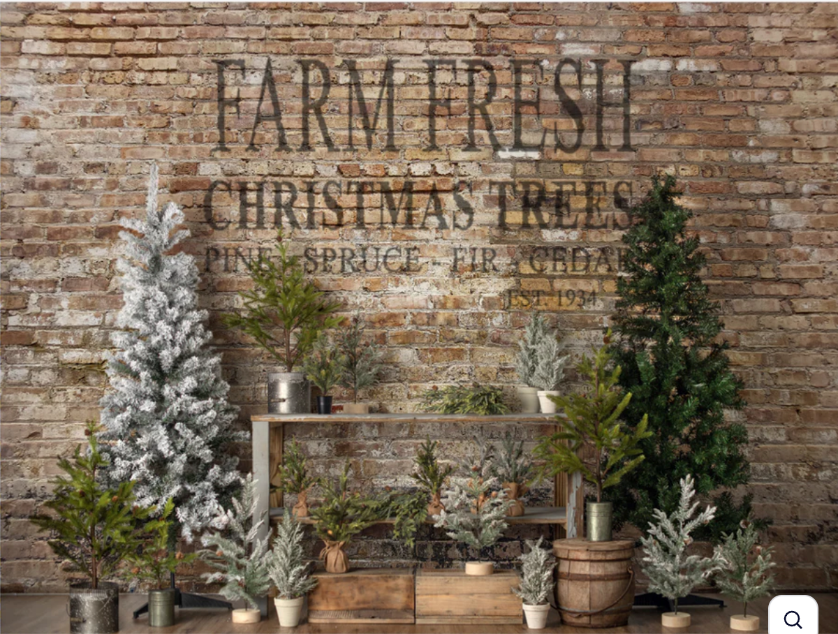 A vintage Christmas scene with a rocking horse, plaid hearts, and red stars against a rustic backdrop.