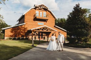 A panoramic collage of a rustic barn-style wedding venue exterior showing different angles throughout the day.