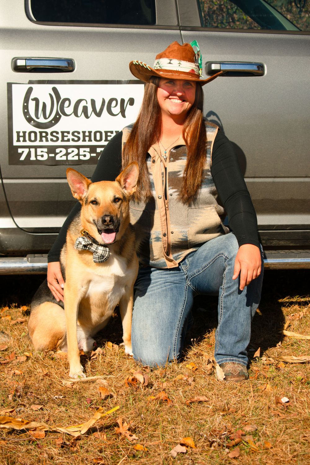 Woman kneeling down next to her dog for a lifestyle photoshoot with her beloved pet.