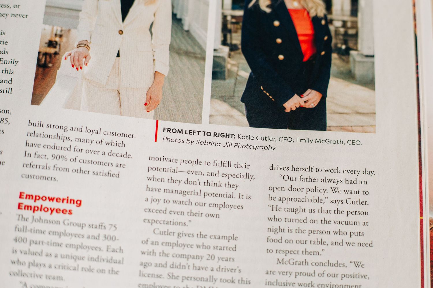 Close-up view of printed Forbes magazine pages showing text columns and a small photograph showcasing the work of Sabrina Jill Photography