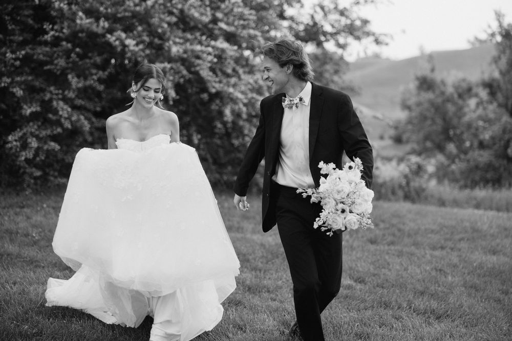 Black and white wedding photos showing romantic moments between bride and groom in an outdoor garden setting.