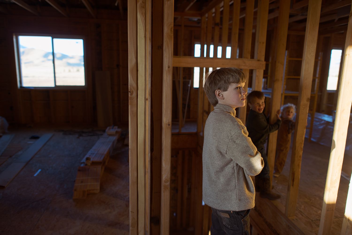 family photos of a house being built on a ranch in idaho