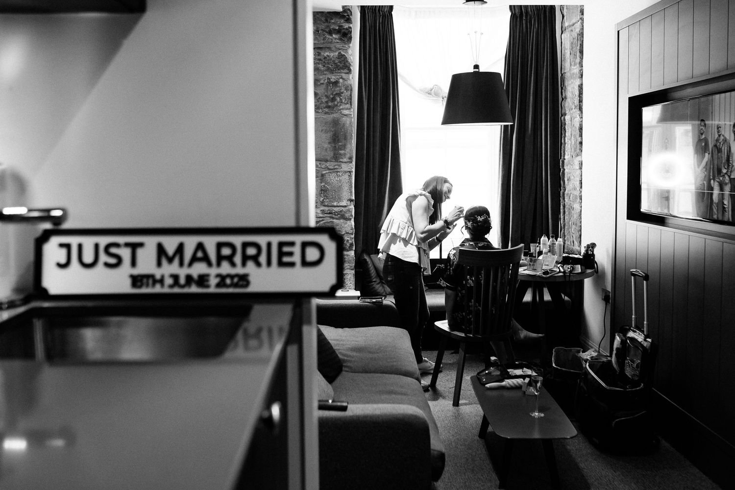 A series of black and white photos showing wedding moments and a 'Just Married' sign in a photo collage.