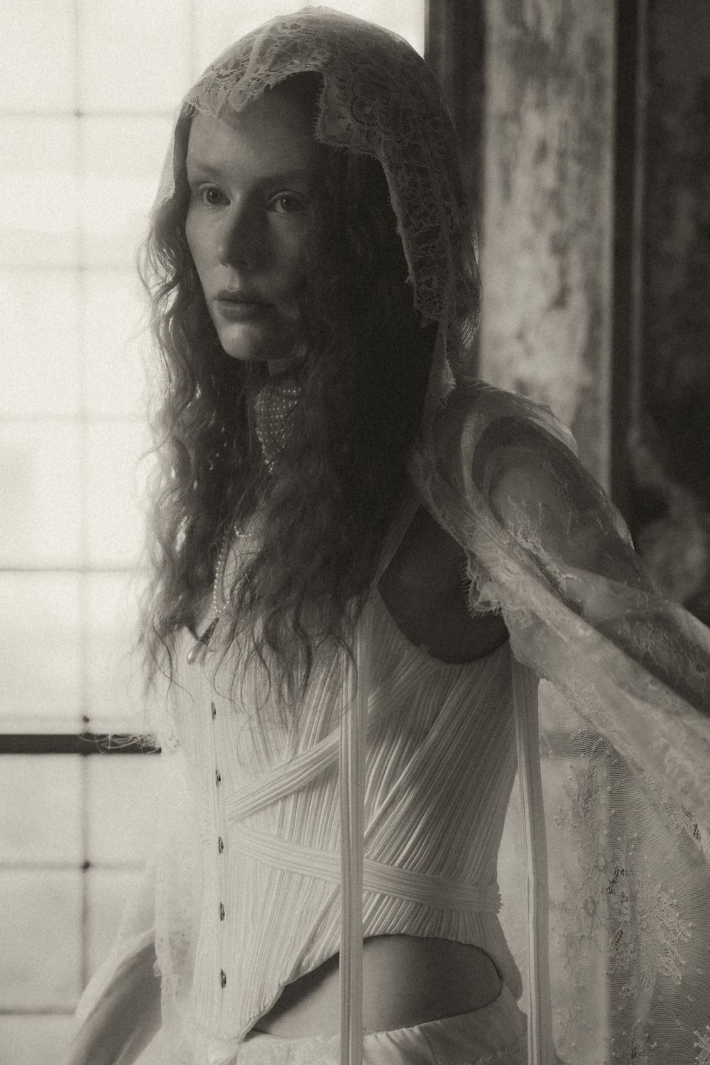 A series of dreamy black and white vintage-style portraits showing a figure in a white dress against a light background.