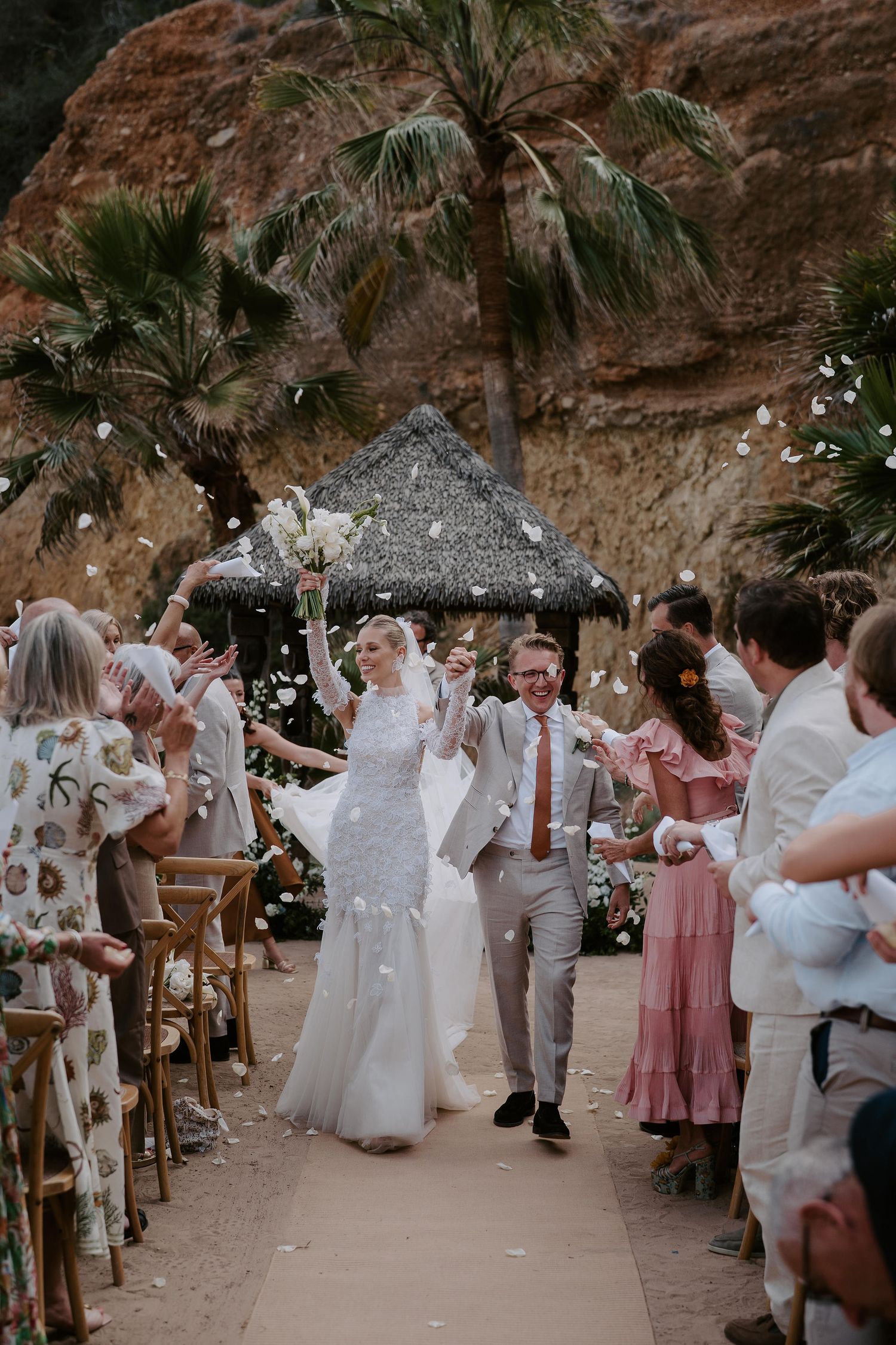 bride and groom exiting ceremony with confetti toss at Amante Ibiza