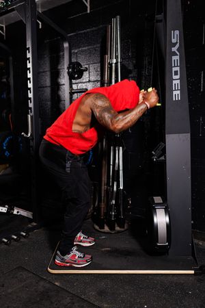 Series of exercise movements showing proper form for cable tricep pushdown workout at the gym.