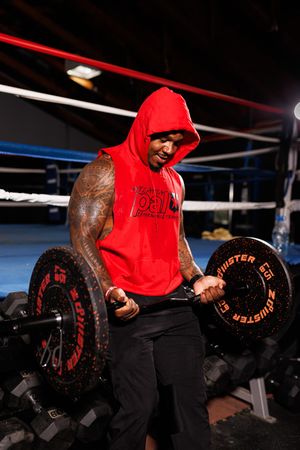 Series of exercise movements demonstrating bent-over barbell row technique in a dark gym setting.