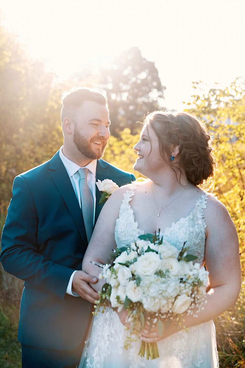Bride and groom portrait together at golden hour.