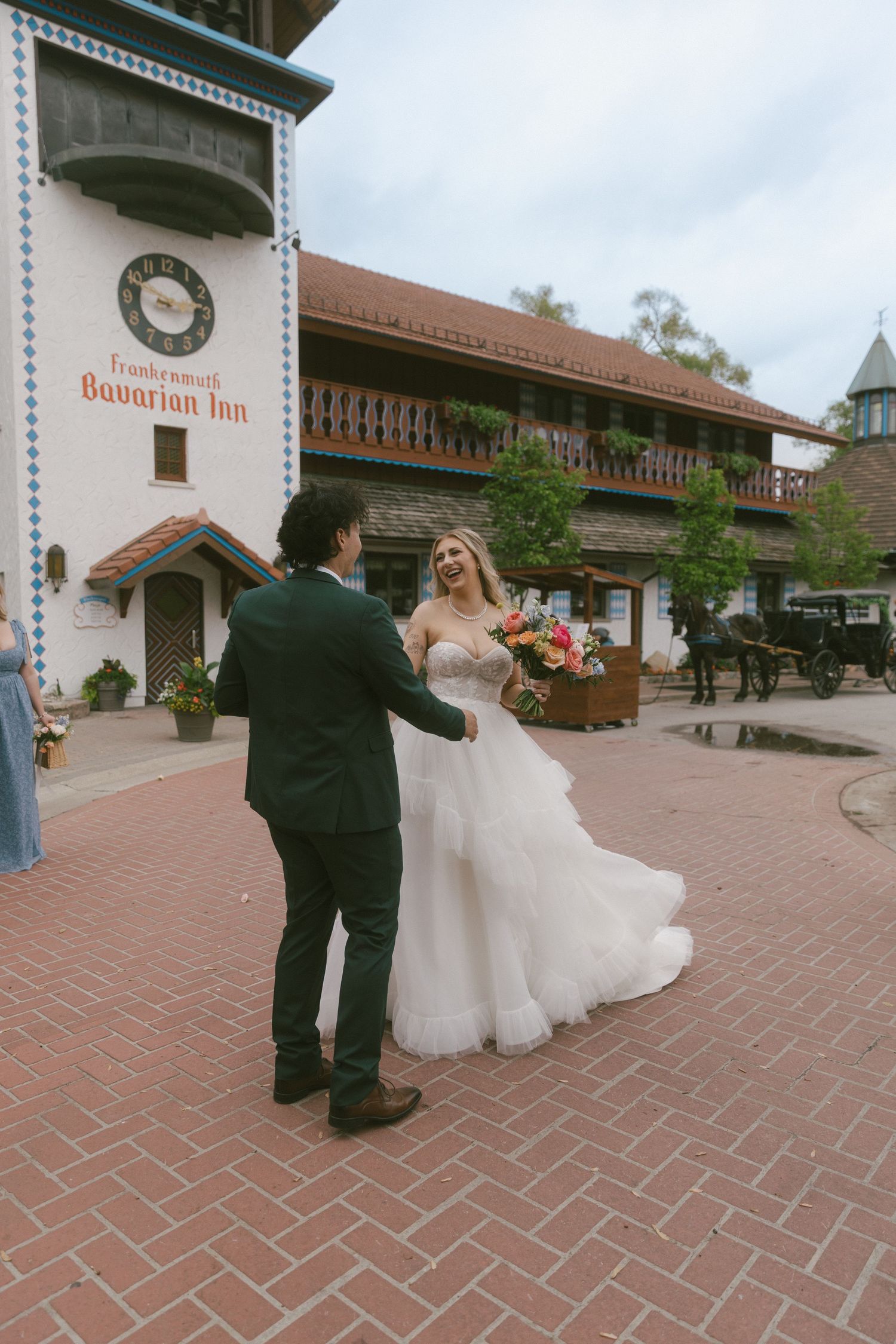 A romantic first dance sequence at a wedding venue with brick pavement and Spanish-style architecture.