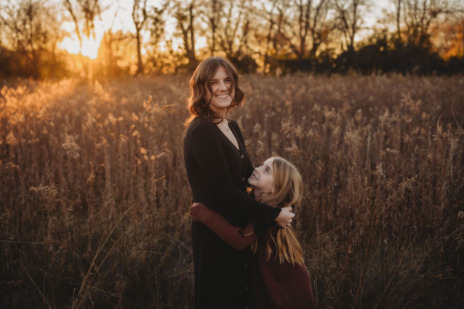 family photo, golden hour, in a field