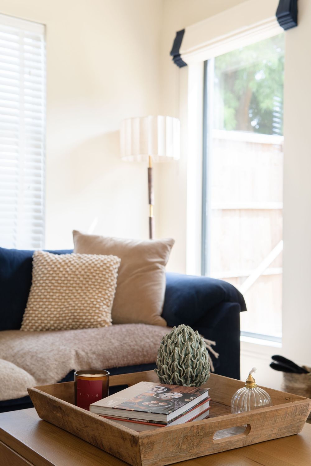 Calm, contemporary interior with considered colour choices, natural light and carefully styled home décor creating a warm, lived-in feel.