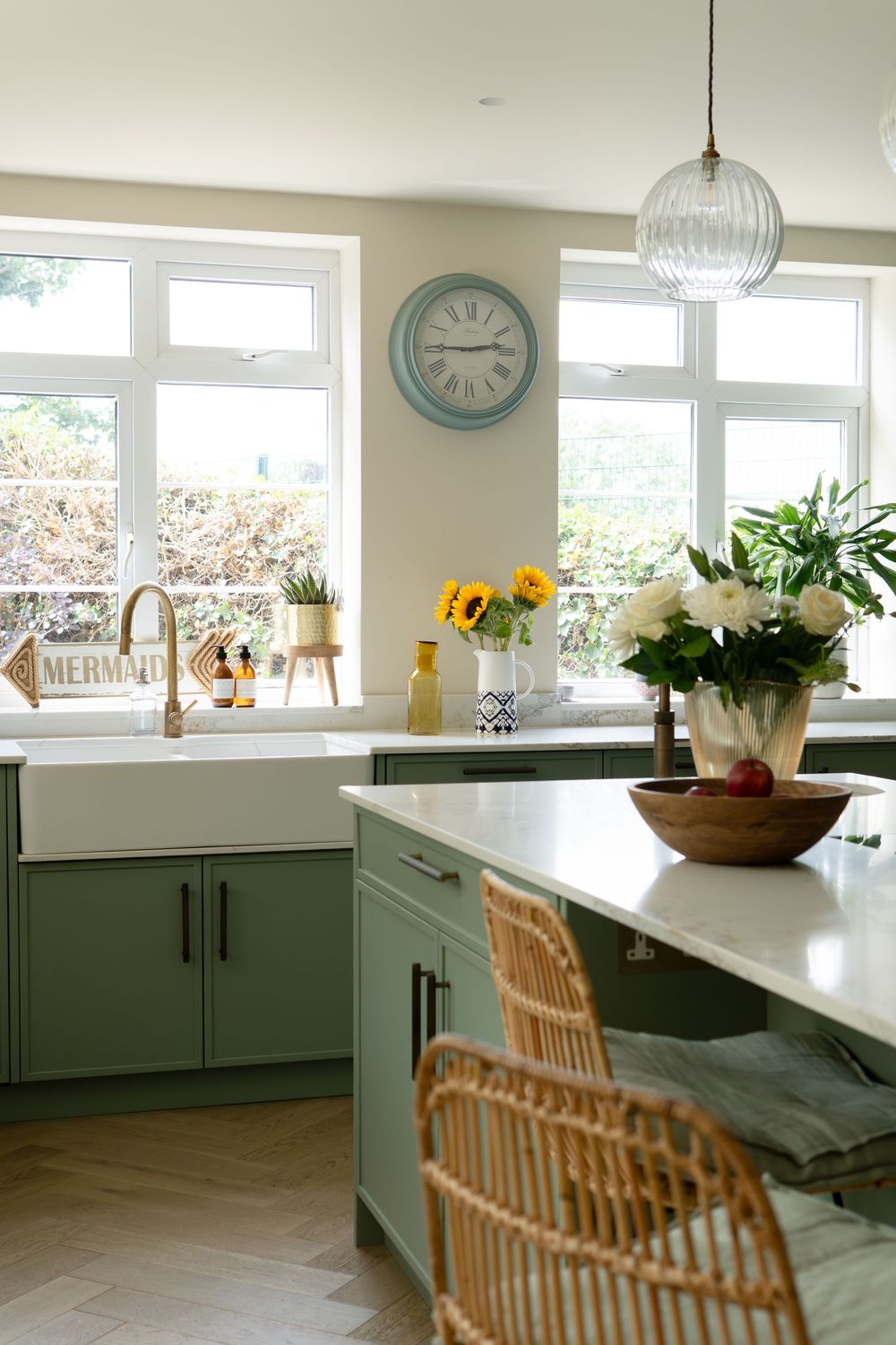 Bright kitchen interior with considered materials, soft colour tones and thoughtful styling by Jacksons Interiors.