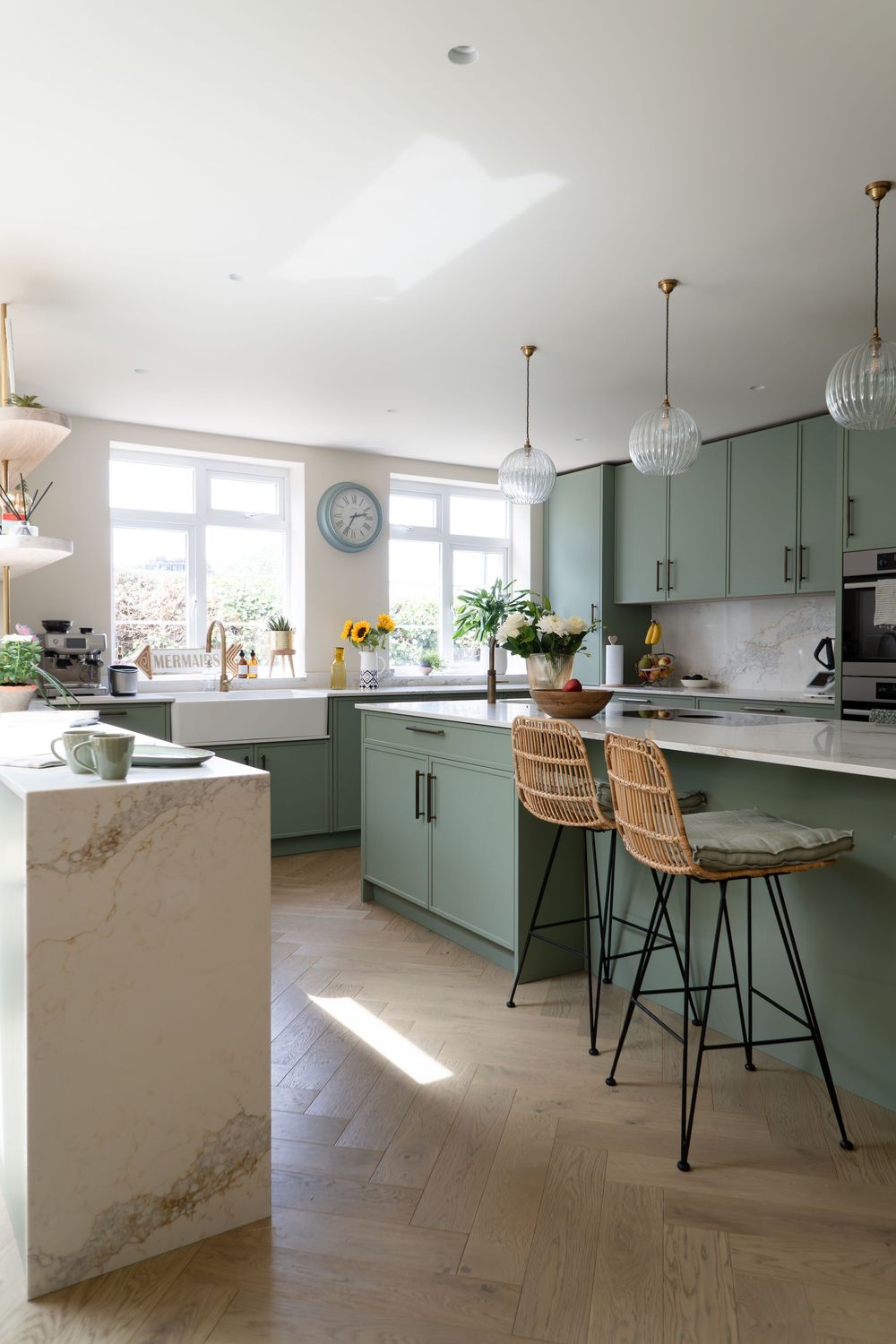 Light-filled open-plan living space, featuring layered textures, soft neutral tones and thoughtful styling details