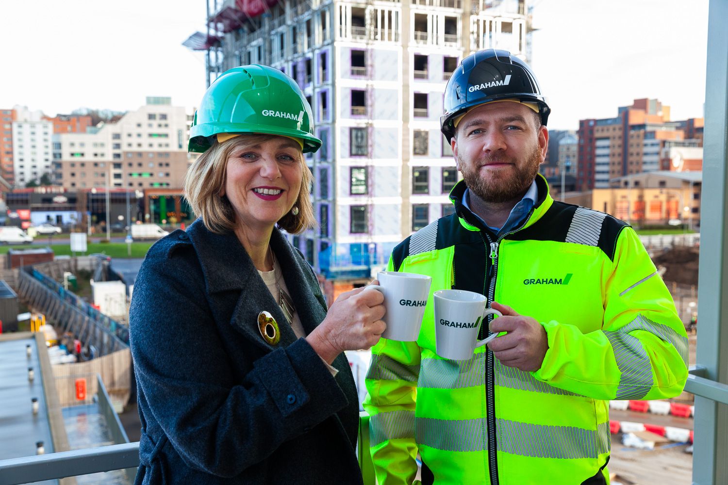 Photograph of local transport minister with project manager on visit to GRAHAM Dyecoats Leeds site