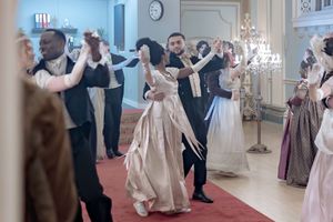 Behind the scenes of a Bridgerton Netflix filming setup at Newark Town Hall, showing close up of two dancers.
