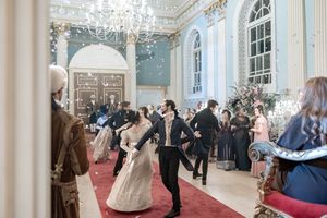 Behind the scenes of a Bridgerton Netflix filming setup at Newark Town Hall, showing the full scale of the ballroom with all the dancers.