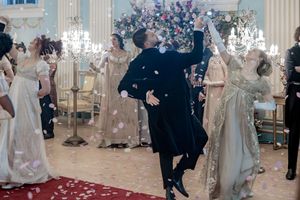 Behind the scenes of a Bridgerton Netflix filming setup at Newark Town Hall showing two dancers mid dance routine within the ballroom.