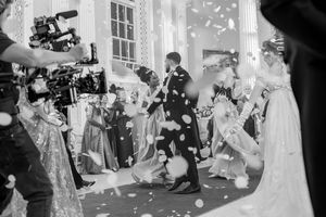 Behind the scenes of a Bridgerton Netflix filming setup at Newark Town Hall, a black and white image showing the filming of the cast dancing