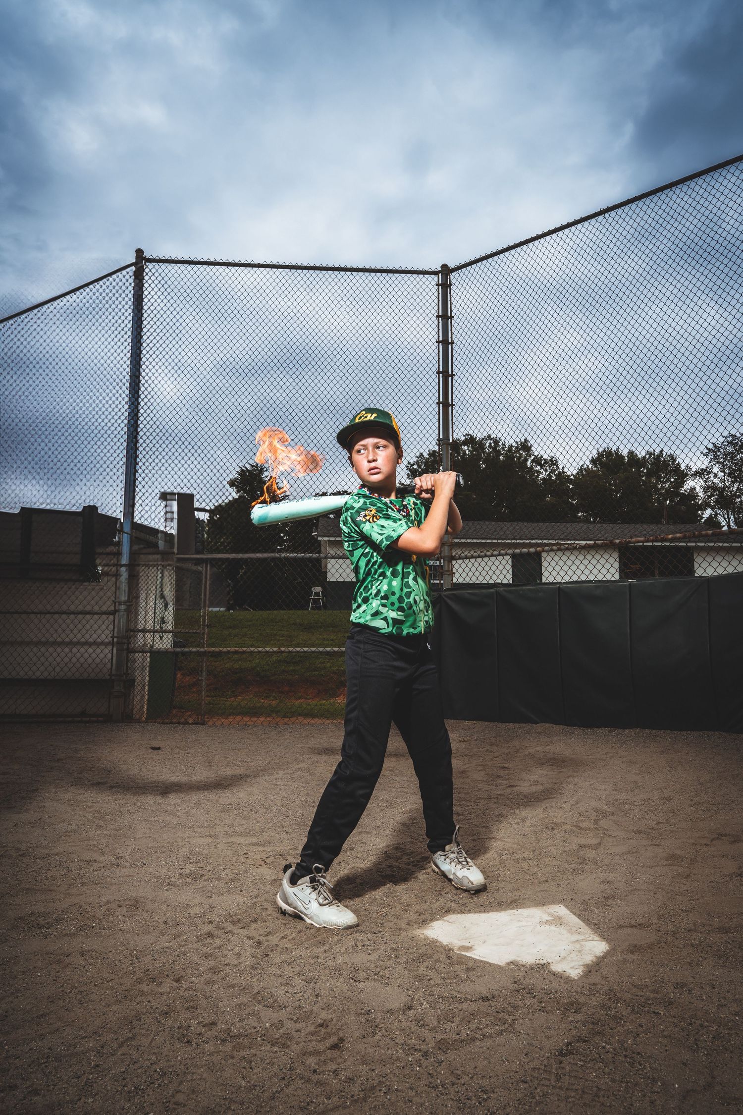 Sequential baseball pitching motion shown in four frames demonstrating proper throwing technique on a dirt field.