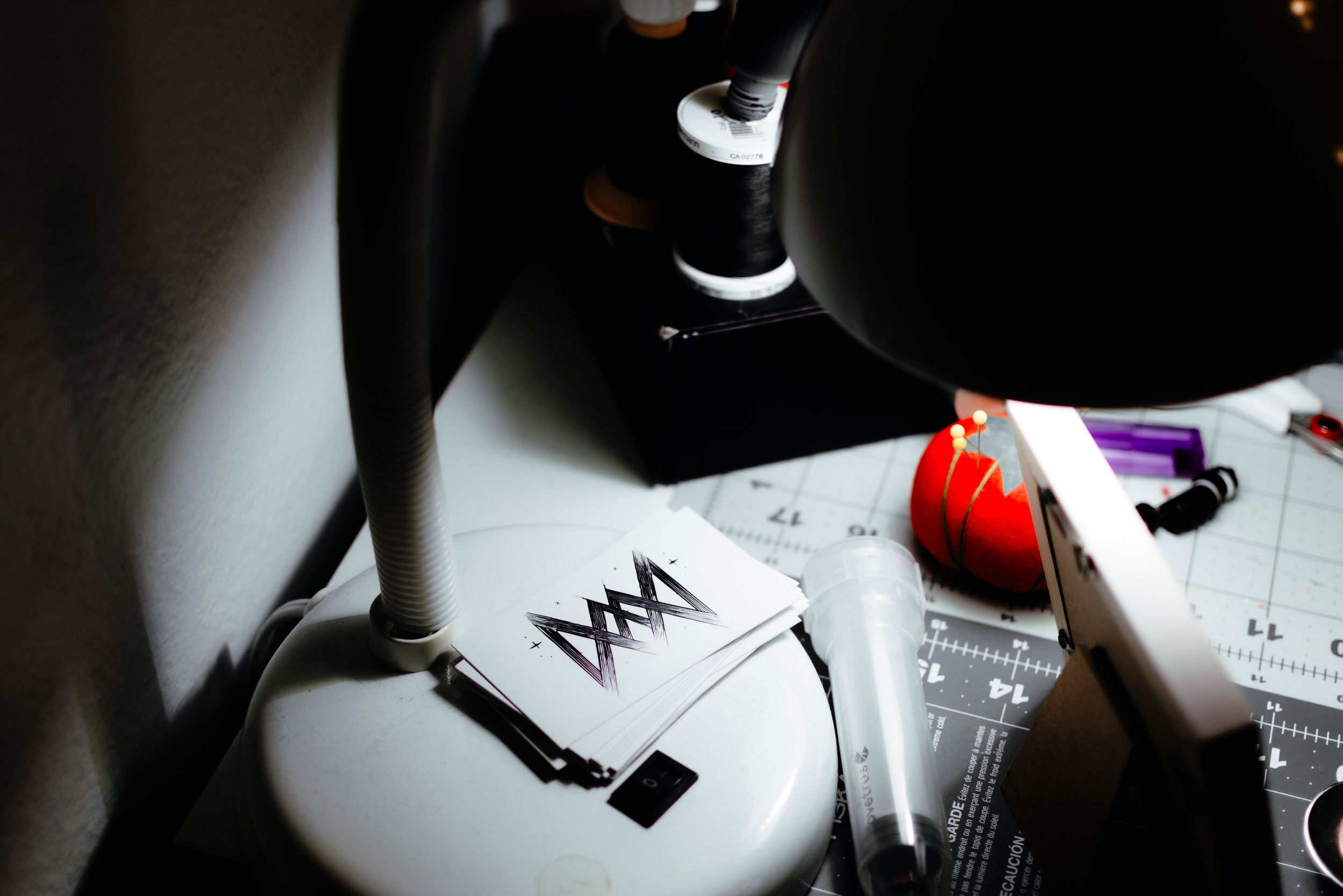 Business card with logo on it under dramatic lighting