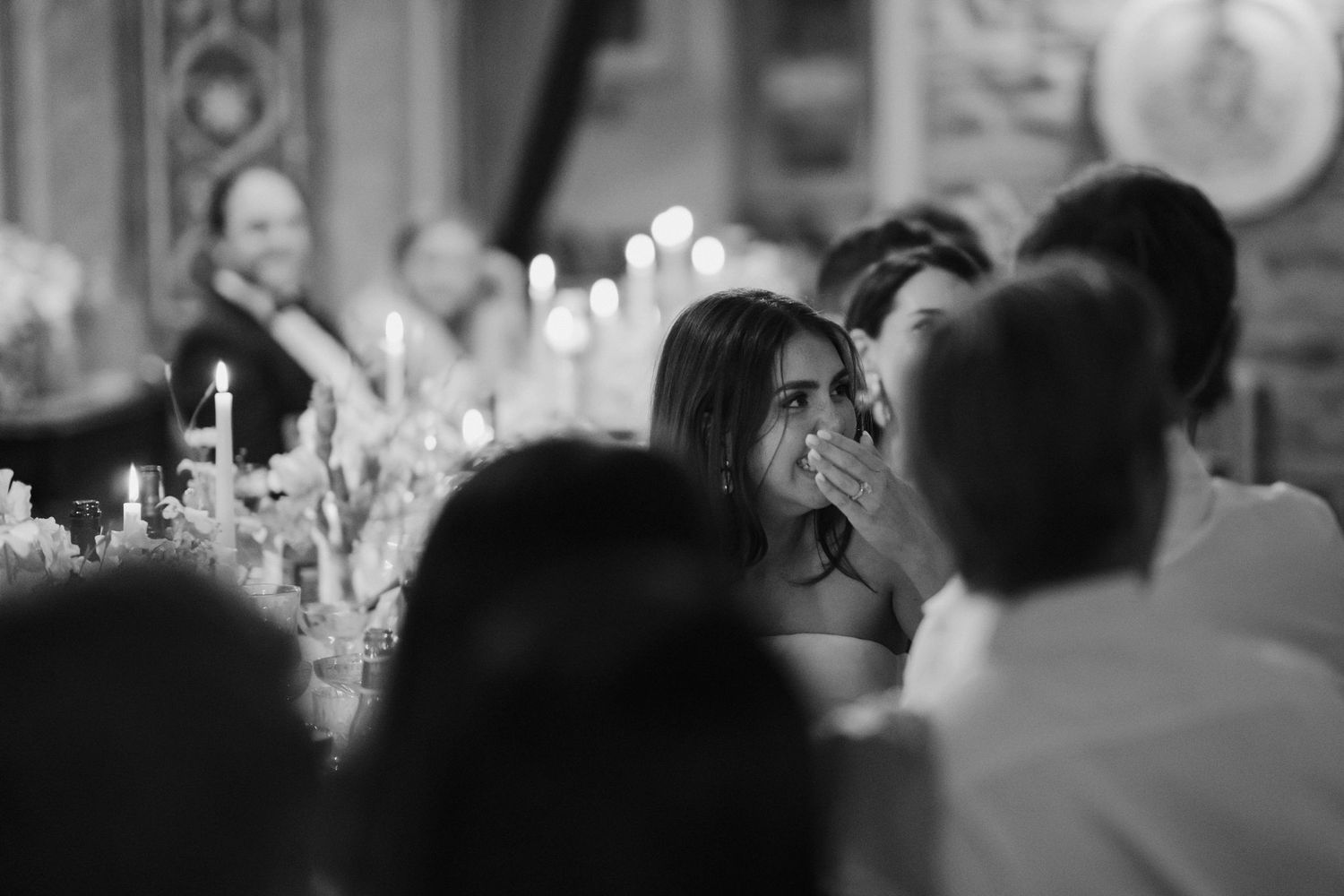 bride covering her face during friends wedding speech at dewsall court in herefordshire