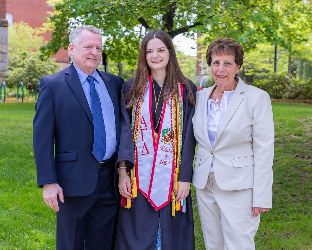 Worcester Poly Tech graduation cap and gown portraits on campus. Graduation portraits for Boston University, Boston College, Regis College.