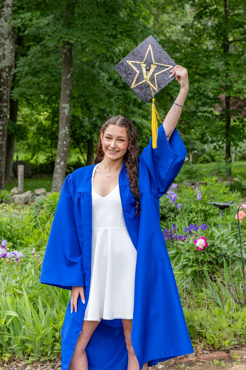 Lincoln Sudbury High School graduate pose in her cap & gown for graduation portraits. Serving Weston High School & Wayland, Concord Carlisle