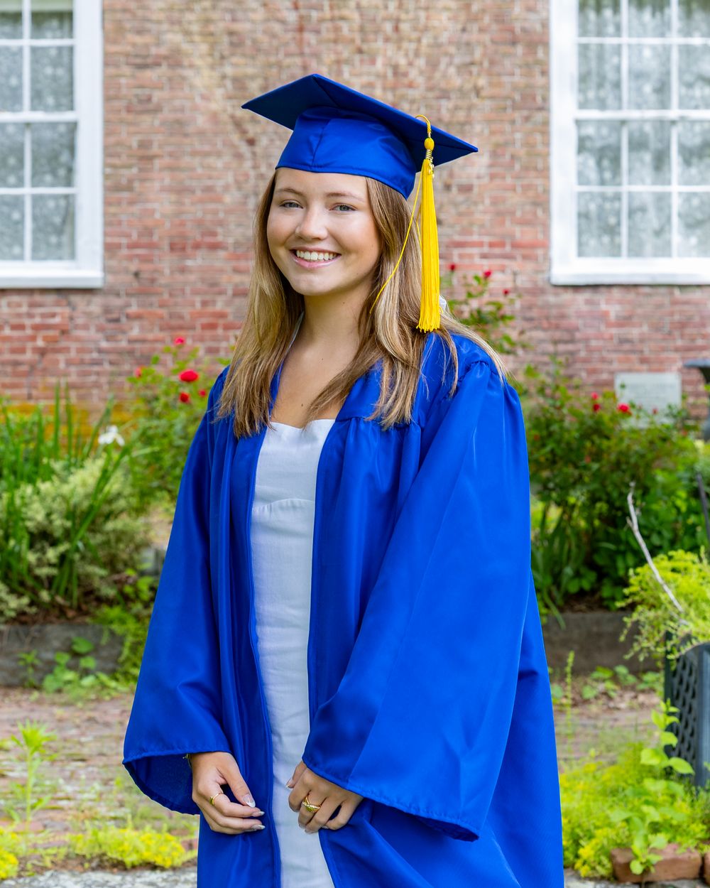 Lincoln Sudbury High School graduate pose in her cap & gown for graduation portraits. Serving Weston High School & Wayland, Concord Carlisle