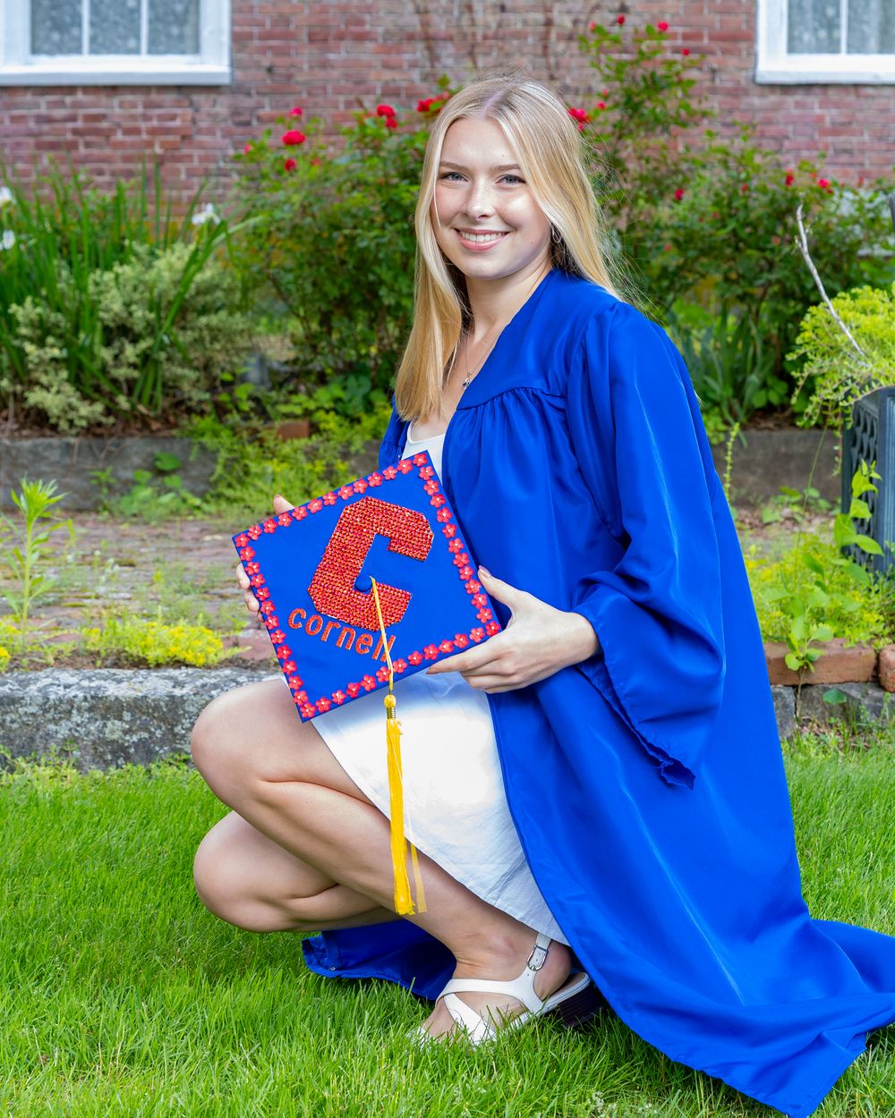 Lincoln Sudbury High School graduate pose in her cap & gown for graduation portraits. Serving Weston High School & Wayland, Concord Carlisle