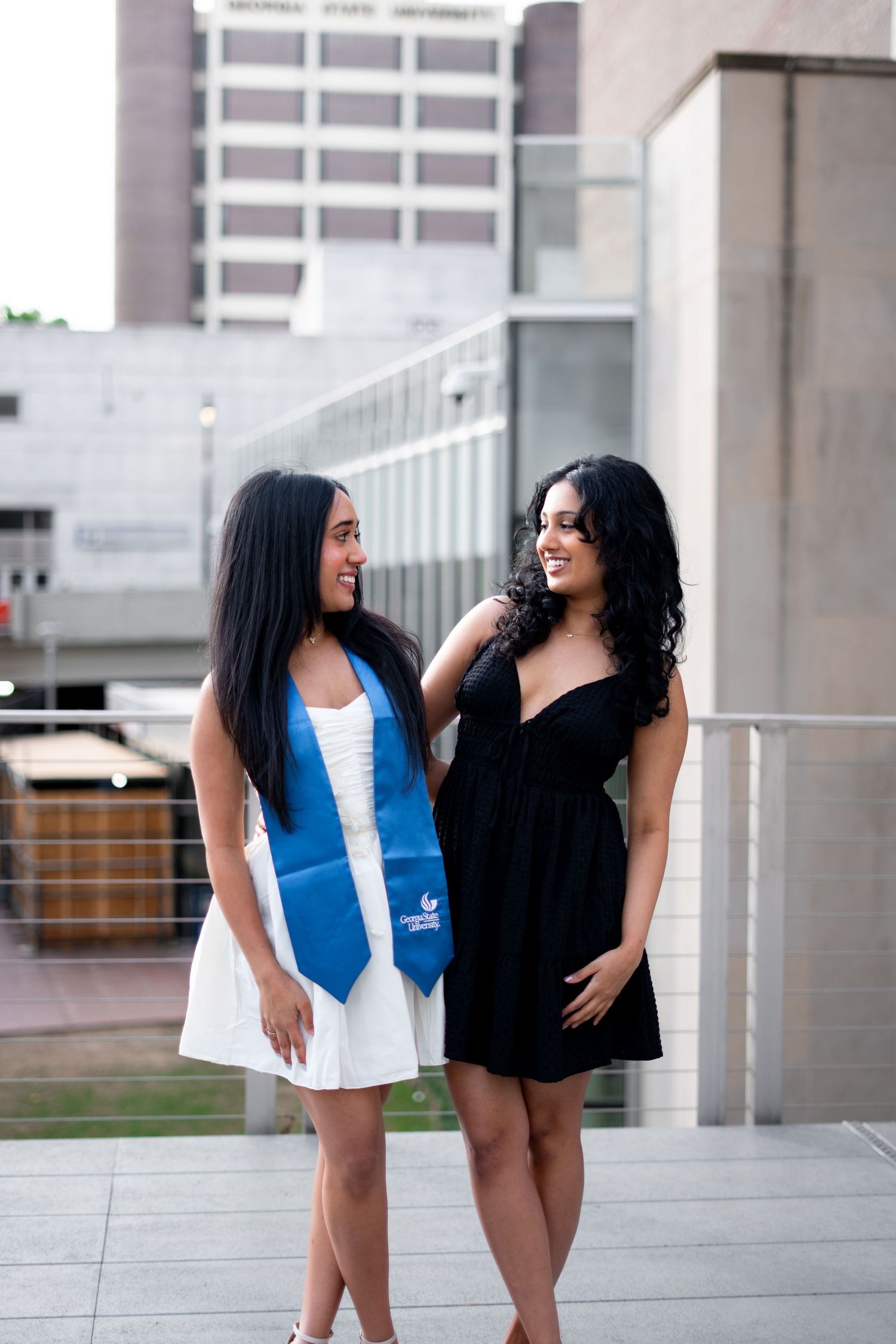 Smiling graduates poses for the best Atlanta grad photos at Georgia State University with portraits by Pierre The Pear Photography