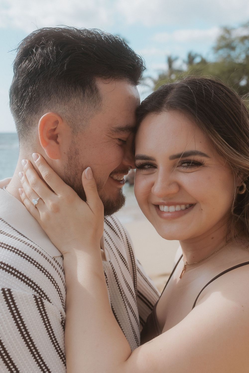A romantic beach photoshoot series showcasing tender moments between a couple at sunset.