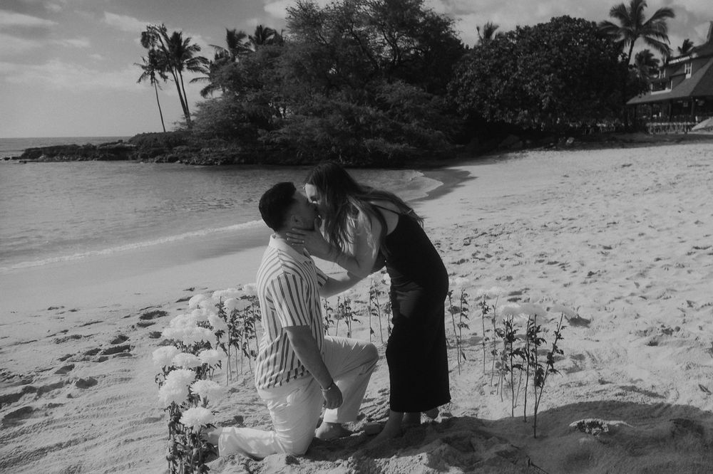 Black and white film style photos showing a couple on a secluded beach with palm trees.