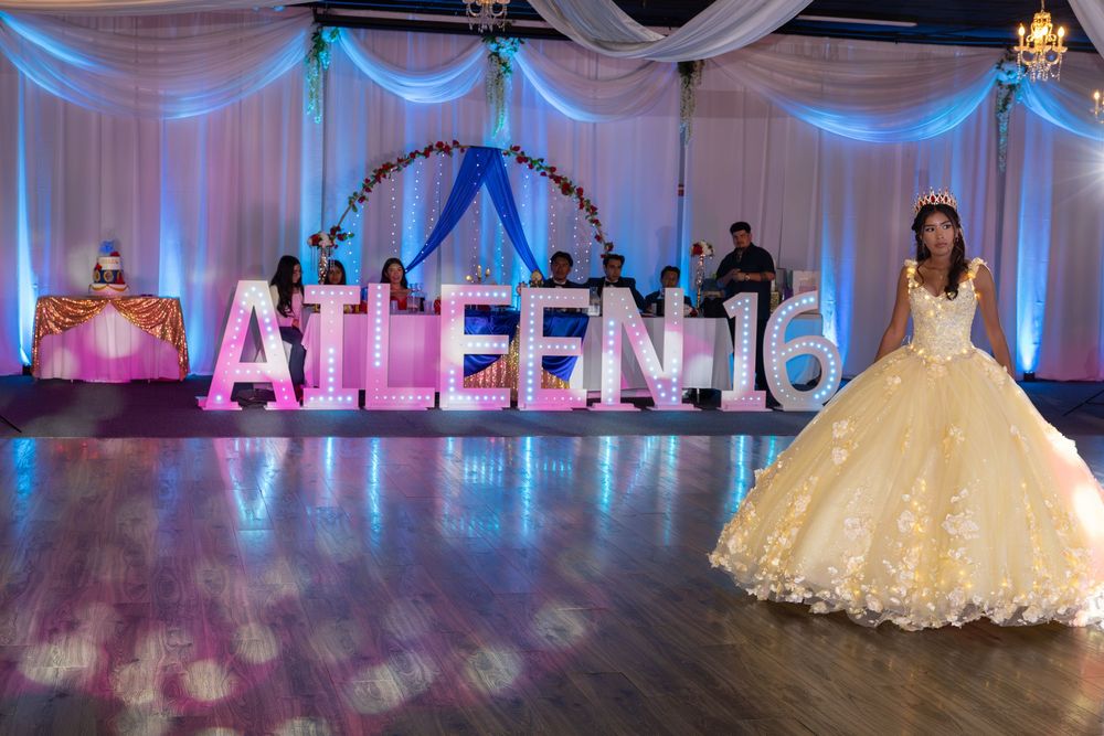 Aileen Sweet XV grand entrance with light-up marquee letters. Stunning reception photography at Parkway Banquets by Alex T Photography.