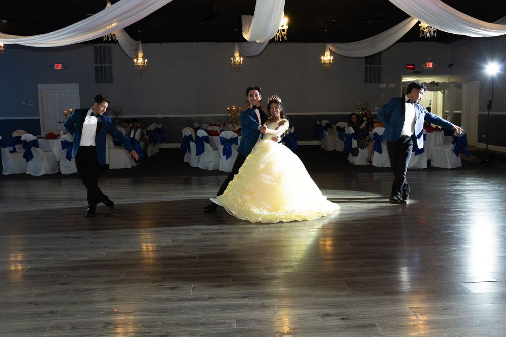 Aileen’s father-daughter waltz in a yellow ballgown. Emotional Quinceañera traditions at Parkway Banquets captured by Alex T Photography.