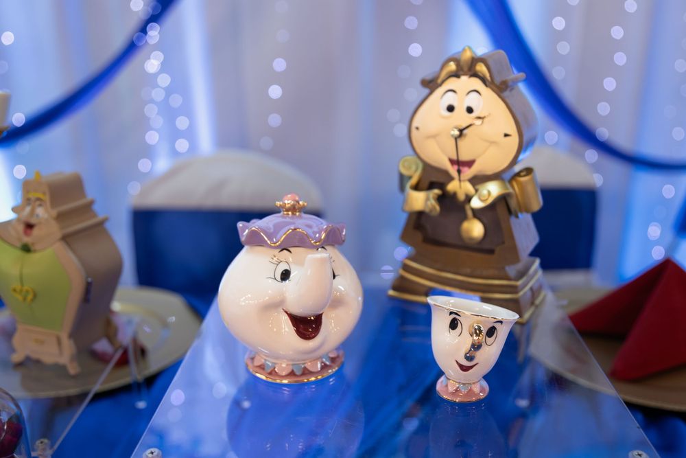 Beauty and the Beast Cogsworth and Mrs. Potts Quinceañera cake toppers. Unique themed XV decor by Alex T Photography in Lake County.