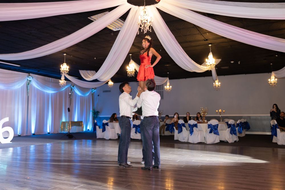 Chambelanes lifting the Quinceañera during the main waltz. Traditional Mis XV celebration moments captured by Alex T Photography.