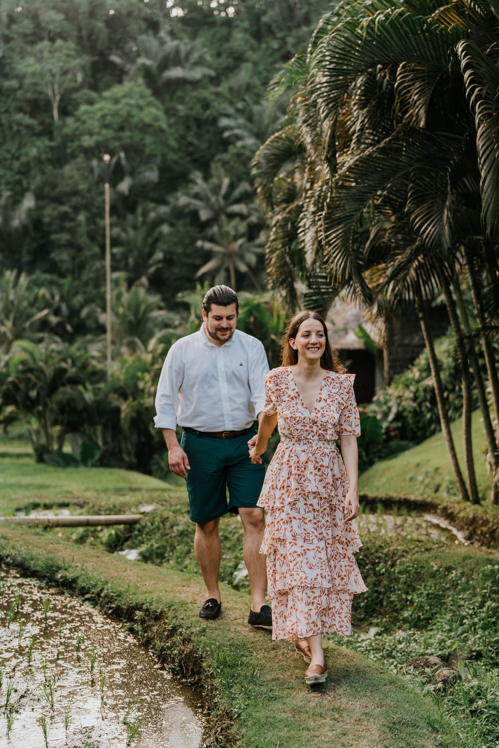 A romantic stroll along a garden path surrounded by lush tropical vegetation.