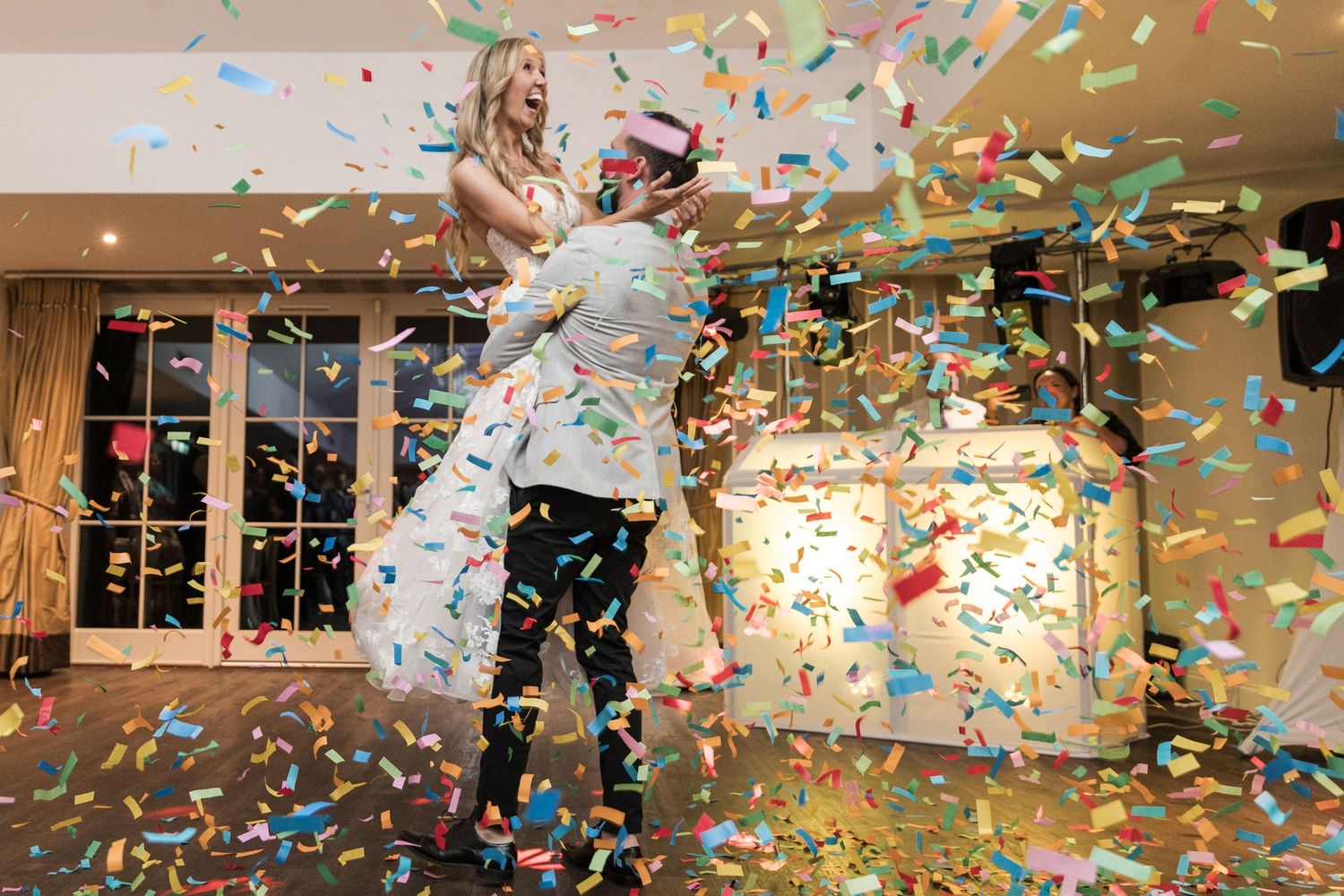 Bride and Groom showered in confetti during their first dance at Kelham House Wedding