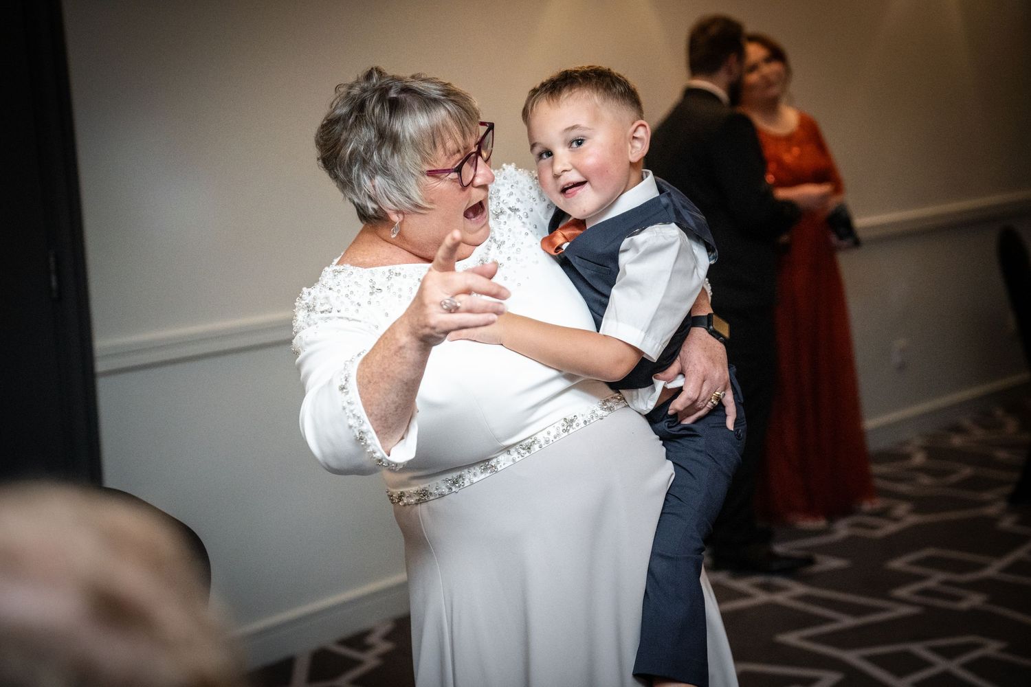 Fun candid moments shared during a special dance at a wedding reception.