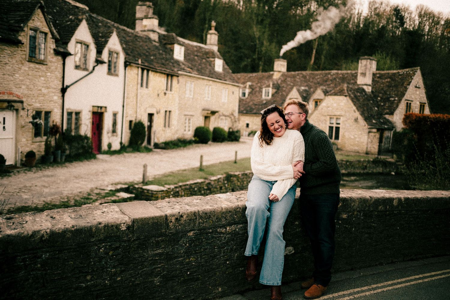 A series of vintage-style photographs showing couples sharing romantic moments in a quaint countryside village setting.