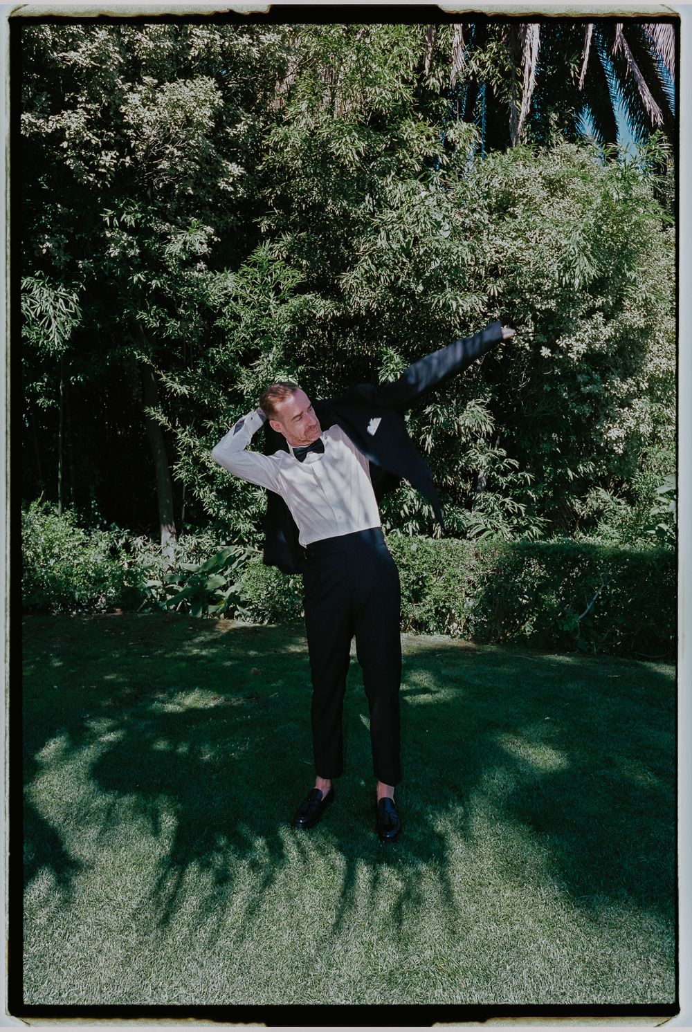 A series of black and white framed images showing a person doing backbends on grass with trees in the background.