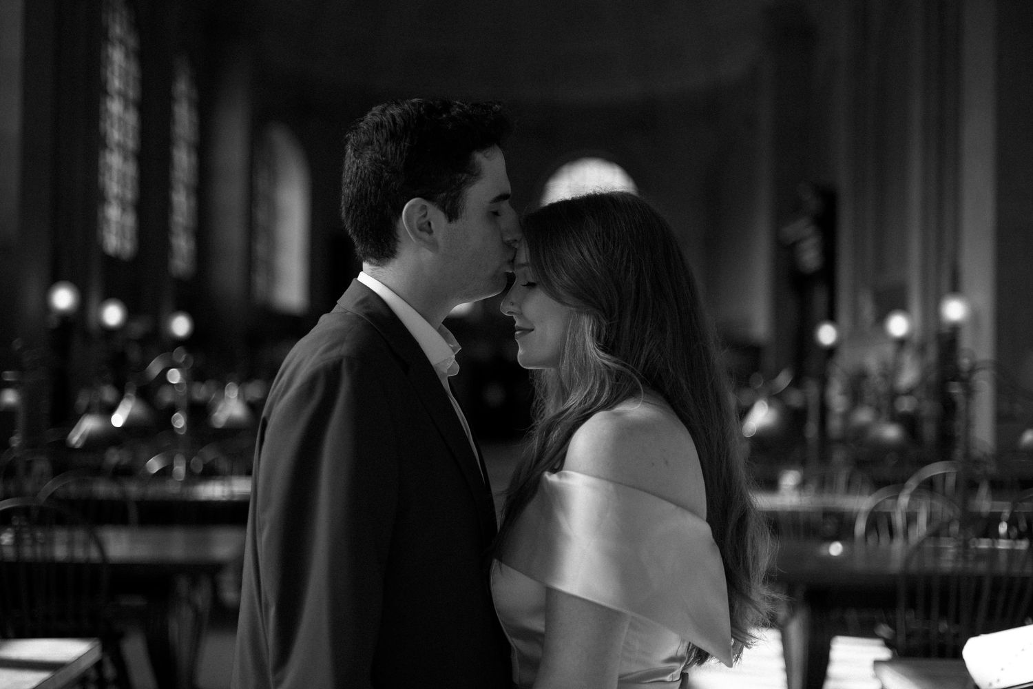 Three romantic black and white wedding photos showing couples dancing and embracing at an elegant reception venue.