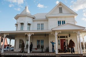 A series of exterior shots showing white Victorian style house details with elegant architectural features and trim work.
