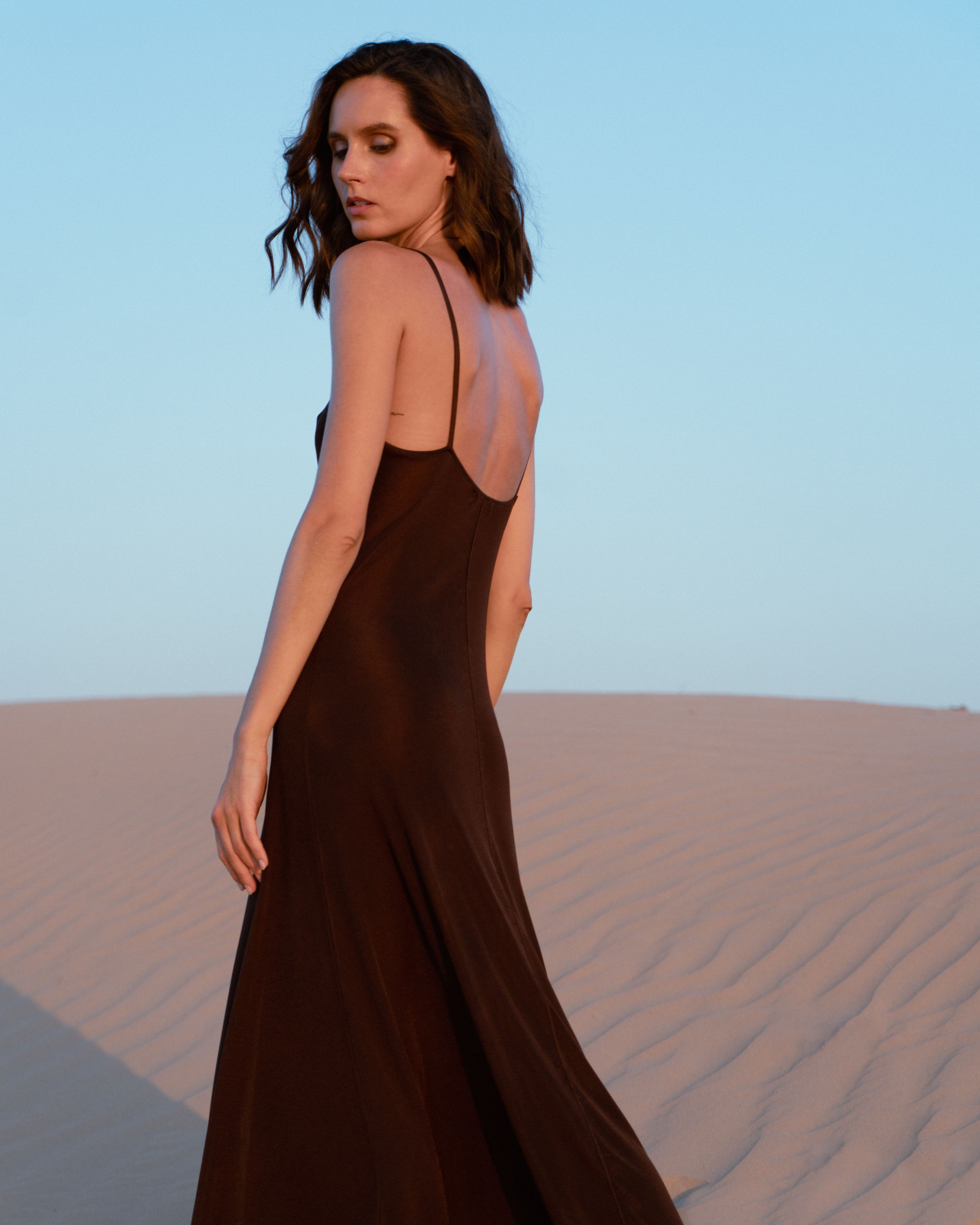 Fashion editorial featuring a model in a desert.
