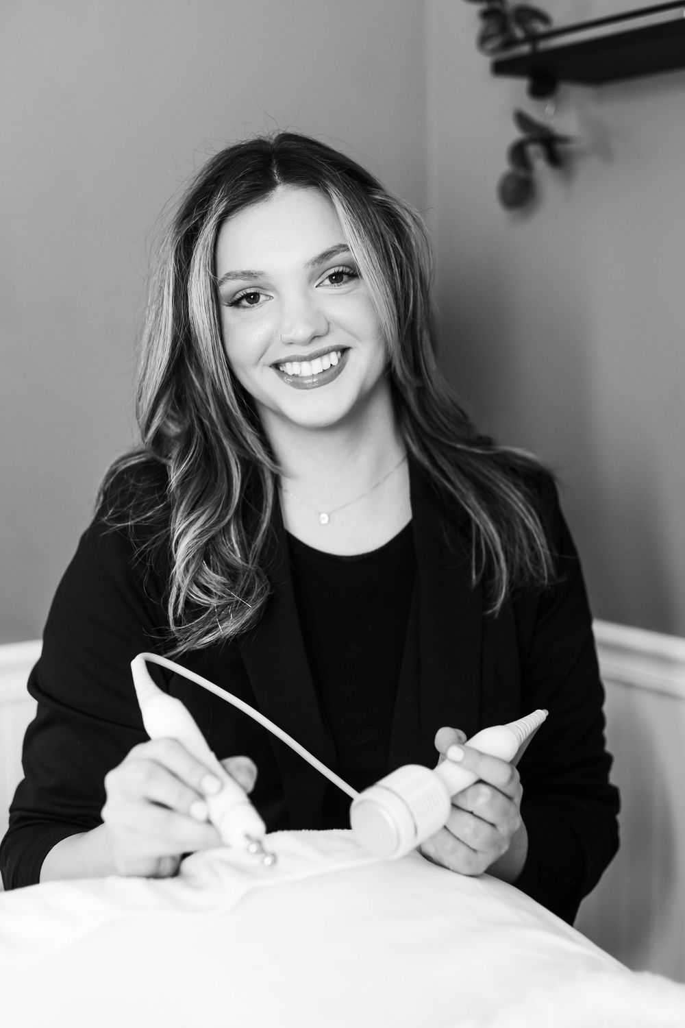 Black and white portrait series showing joyful expressions while writing or drawing.